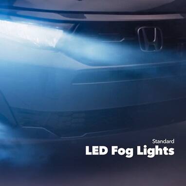 2027 Honda Odyssey Elite in Smoke Blue Pearl front studio showing standard LED fog lights and headlights (Minivan).